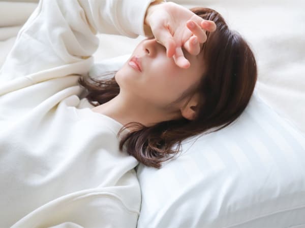 体調不良の女性